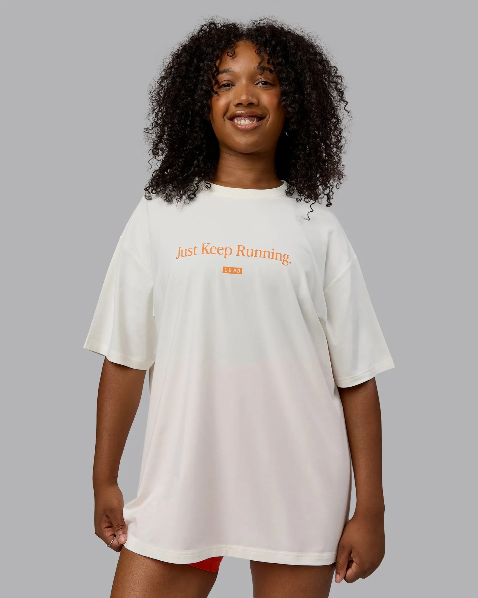 Unisex Just Keep Running FLXCotton Tee Oversize - Off White-Vibrant Orange